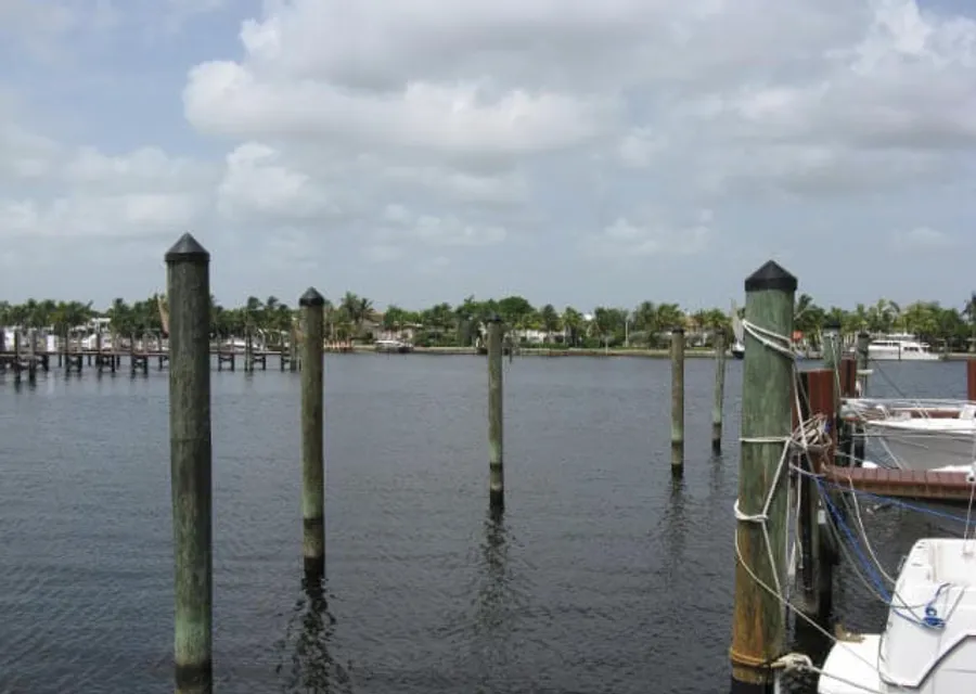 Broward Dock and Seawall work barge and crane on a South Florida waterway