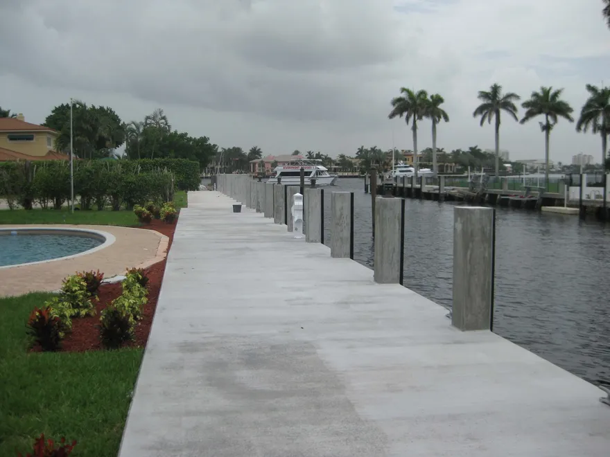 Custom waterfront dock with boat lift built by Broward Dock and Seawall